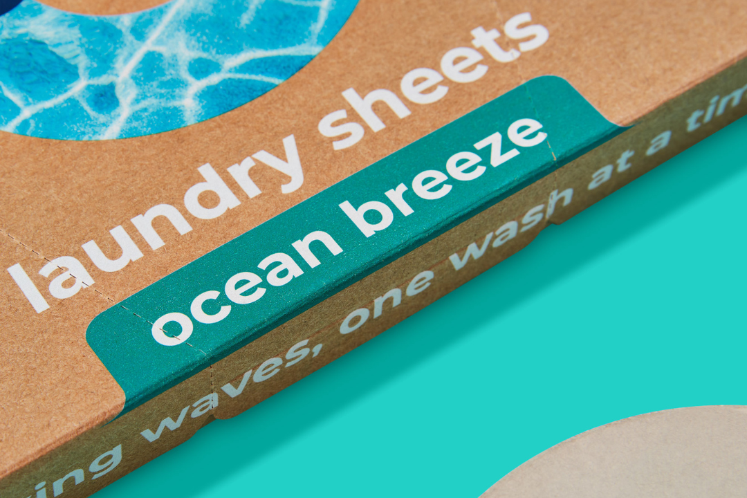 Oceans eco-friendly laundry sheets in Ocean breeze on aqua background