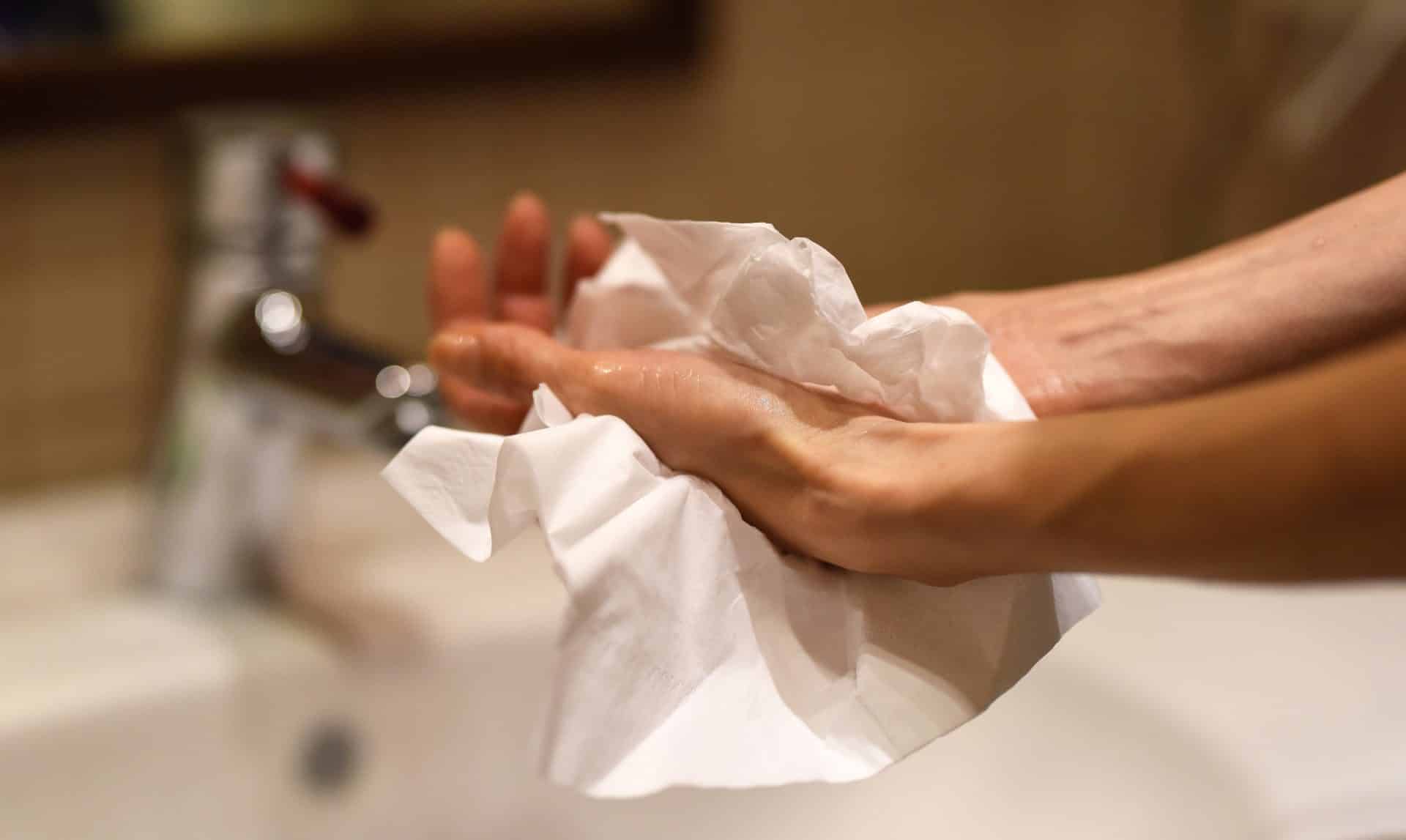 drying hands with a paper towel